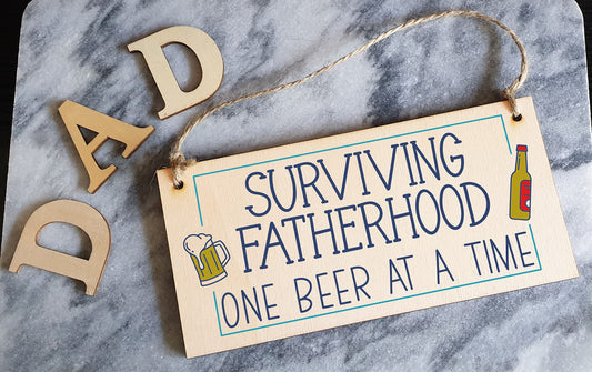 The Plum Penguin Handmade Wooden Hanging Wall Plaque Surviving Fatherhood One Beer at a Time Novelty Sign Man Cave