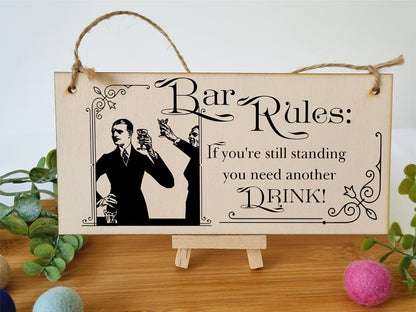 The Plum Penguin Handmade Wooden Hanging Wall Plaque Bar Rules Still Standing Need a Drink Funny Novelty Sign Home Bar