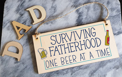 The Plum Penguin Handmade Wooden Hanging Wall Plaque Surviving Fatherhood One Beer at a Time Novelty Sign Man Cave