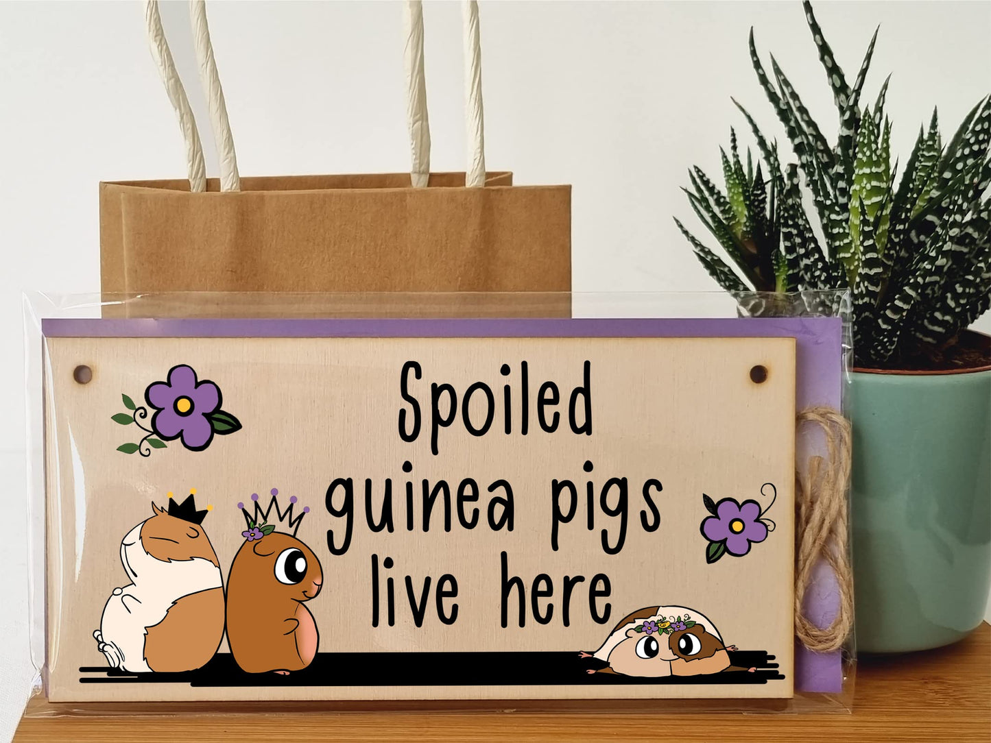 The Plum Penguin Handmade Wooden Hanging Wall Plaque Spoiled Guinea Pigs Live Here Pet Lover Mum Dad Sign